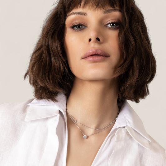 CHOE 1 carat round moissanite necklace in rhodium-plated sterling silver on model