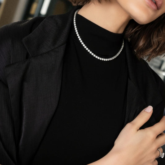 CHOE round bezel tennis necklace in rhodium-plated sterling silver on model