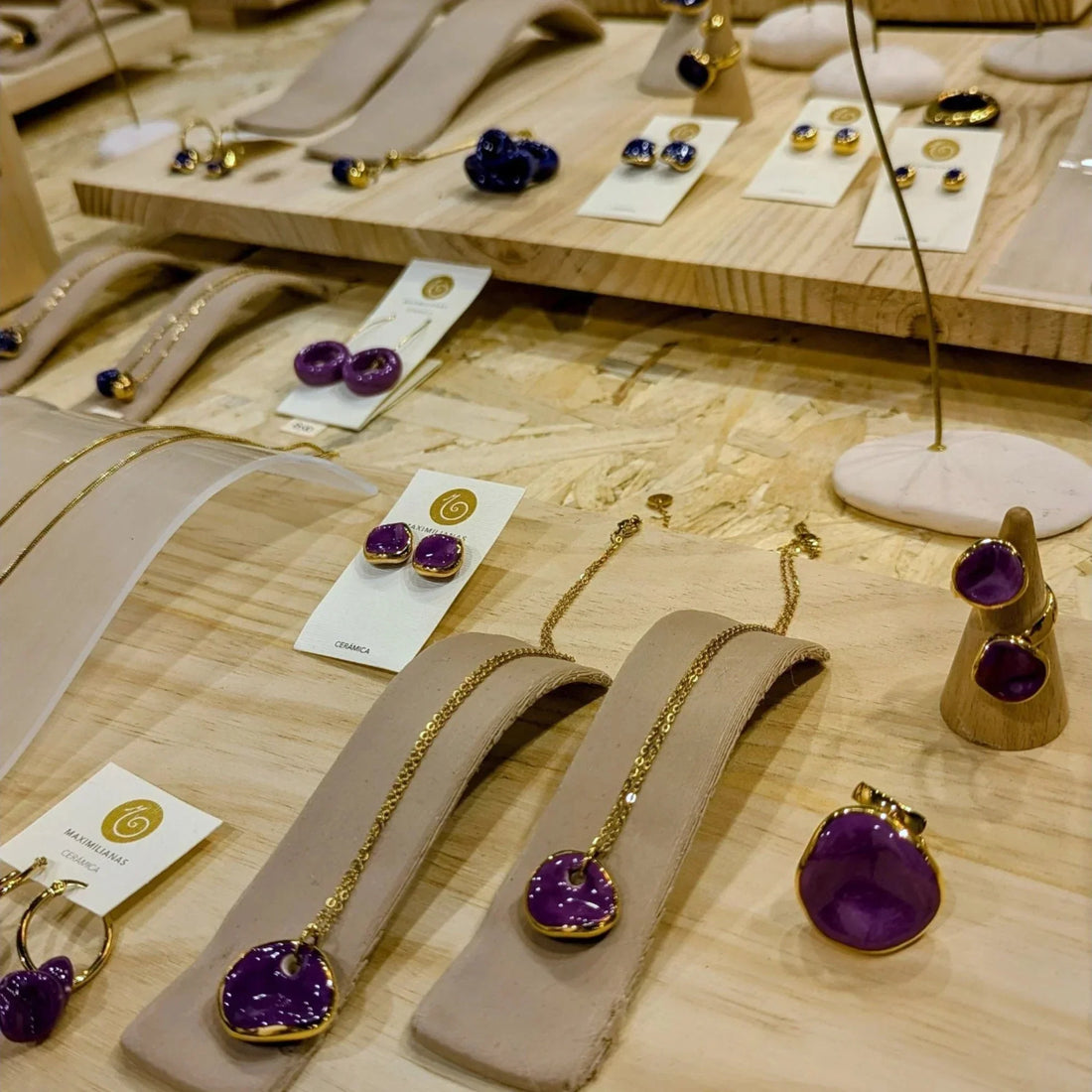 Handcrafted ceramic jewelry pendants from Maximilianas at the Milano Fashion & Jewel Show