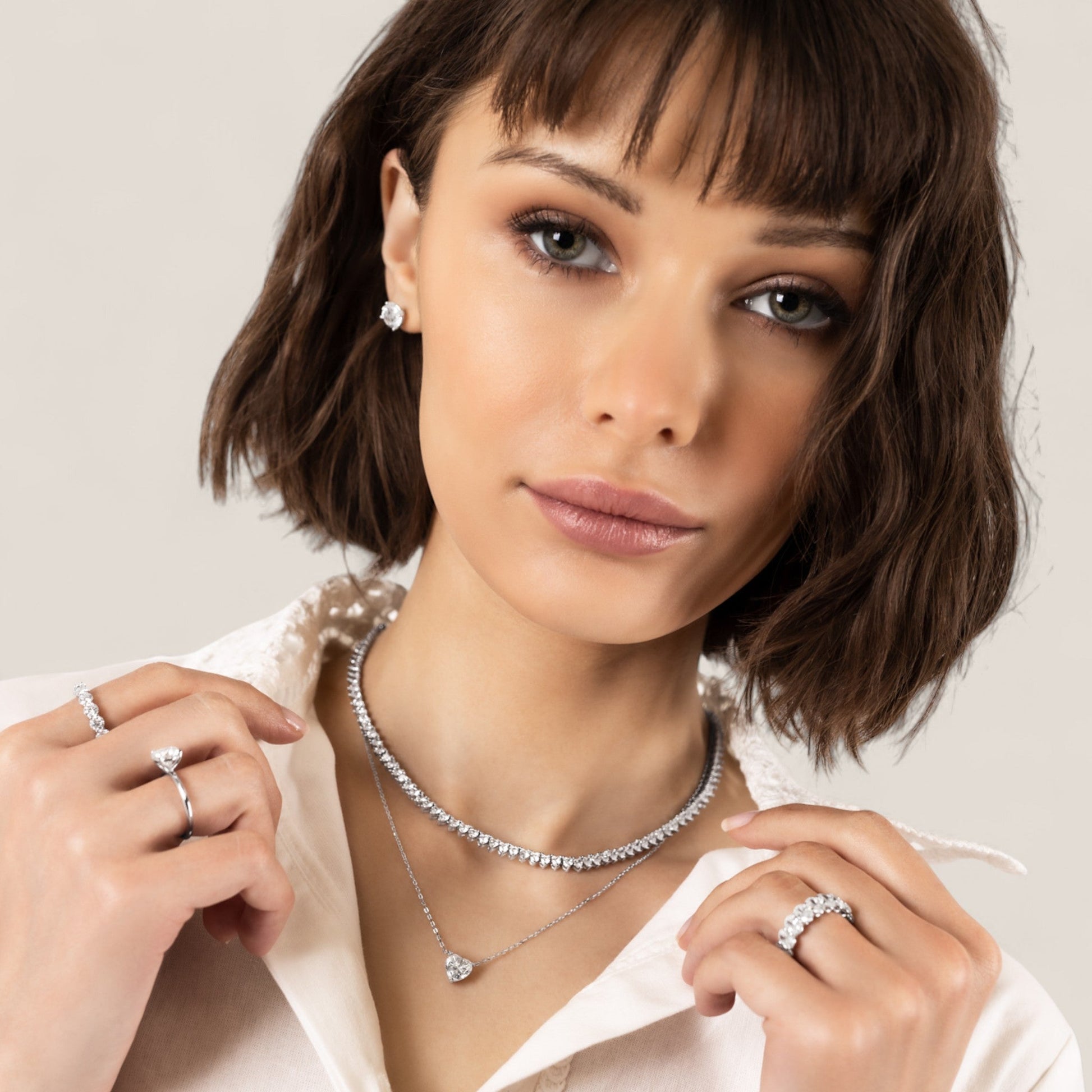 CHOE heart-shaped moissanite pendant necklace in rhodium-plated sterling silver on model