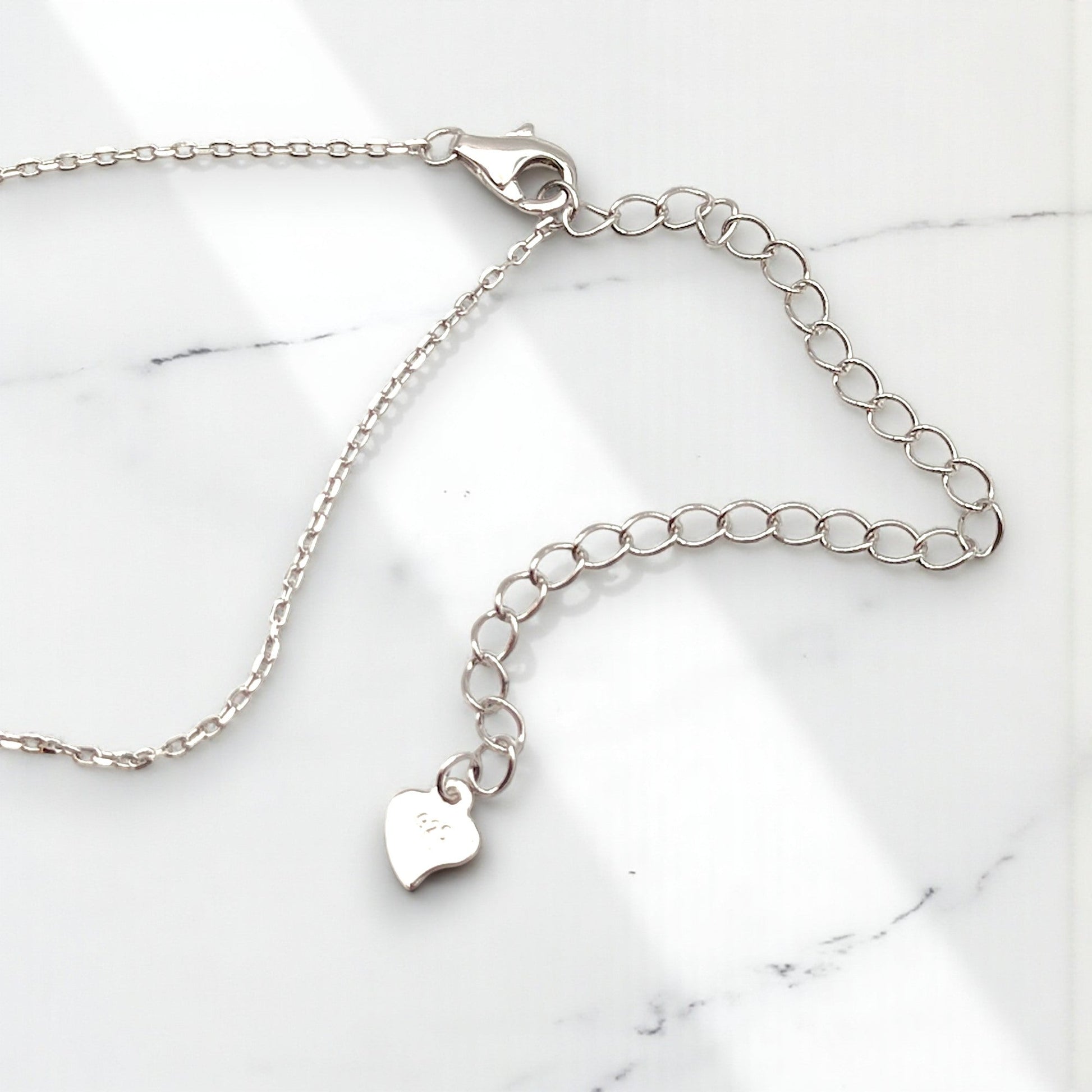 Close-up of CHOE sterling silver chain with lobster clasp