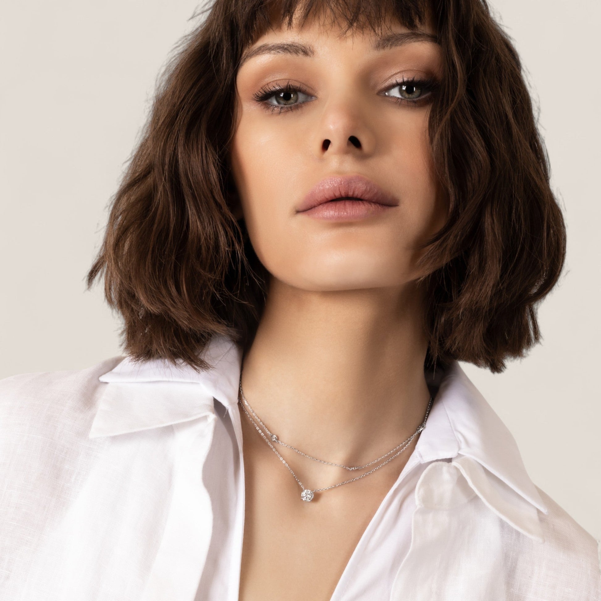 CHOE 1 carat round moissanite necklace in rhodium-plated sterling silver on model