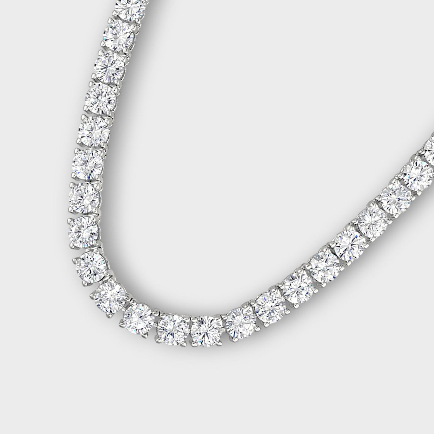 Close-up of CHOE tennis necklace with round four prong setting in sterling silver