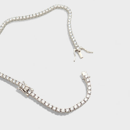 Close up of CHOE silver tennis necklace with extender