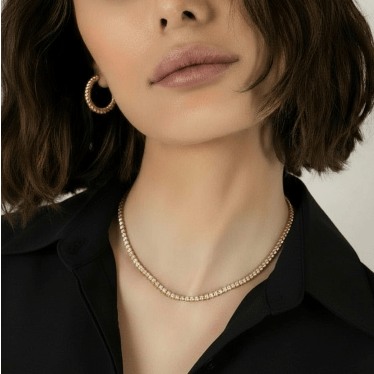 CHOE classic tennis necklace in gold vermeil - close up of a woman wearing the tennis necklace