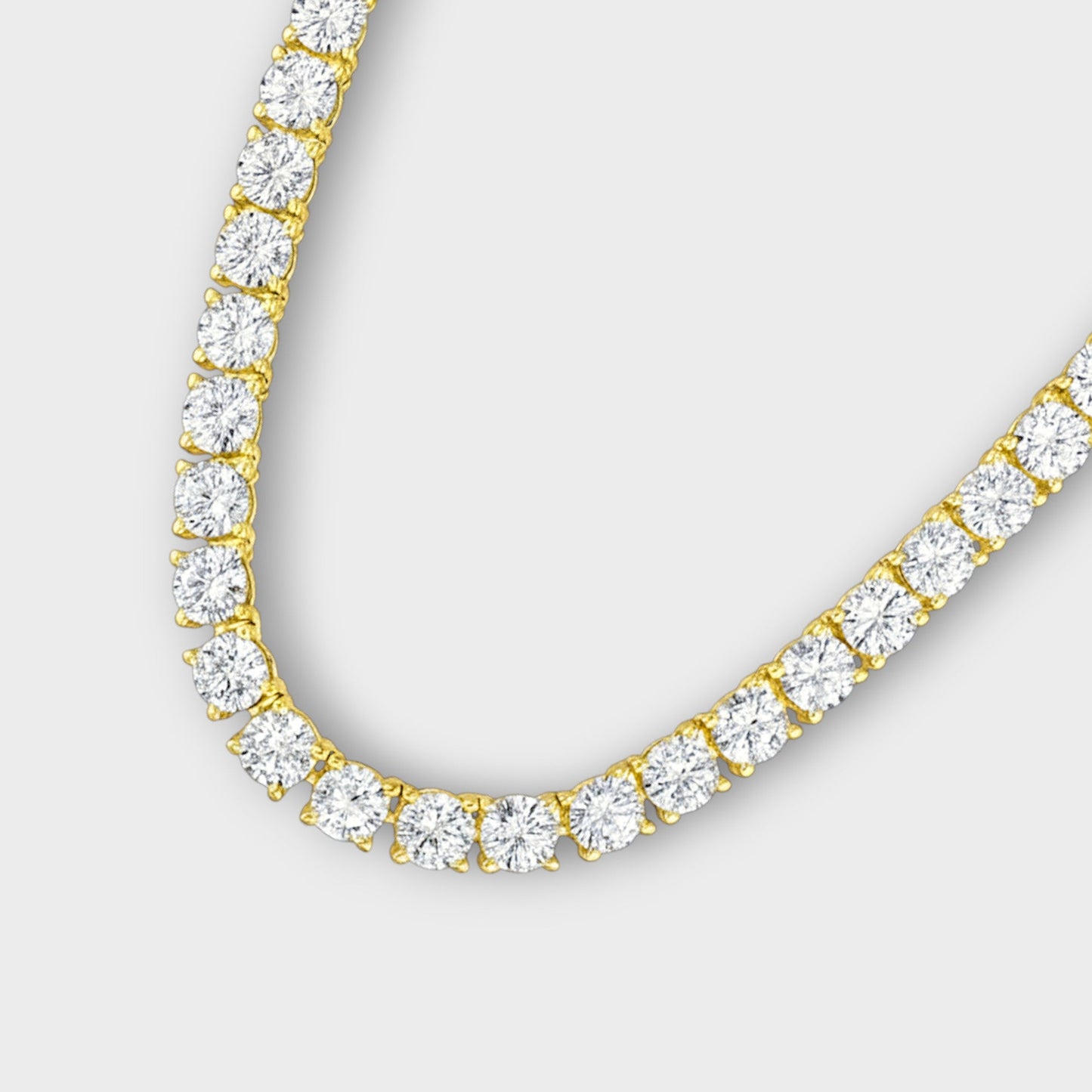Close-up of CHOE tennis necklace prong setting in gold vermeil