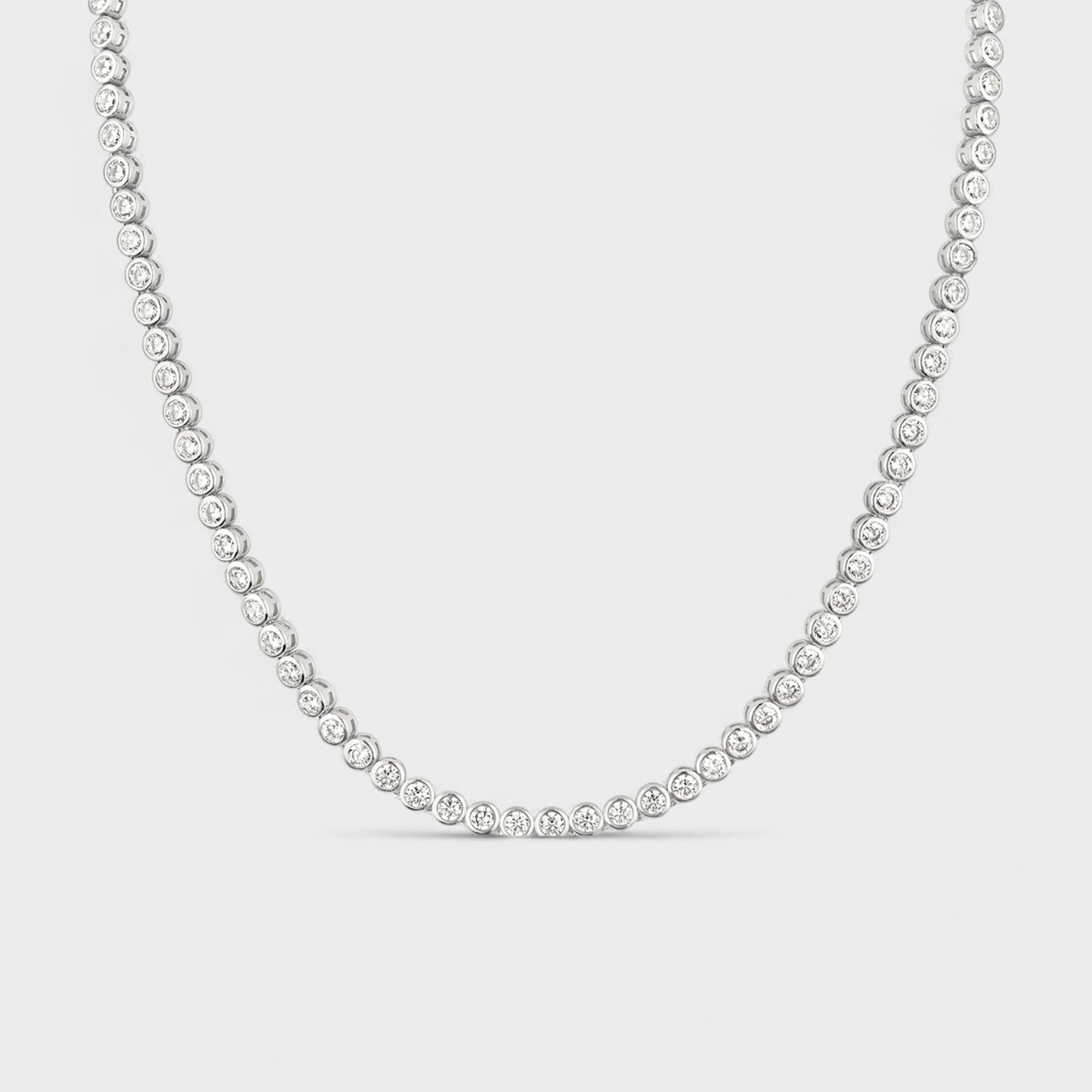 CHOE sterling silver tennis necklace with cubic zirconia bezel setting - hero shot.