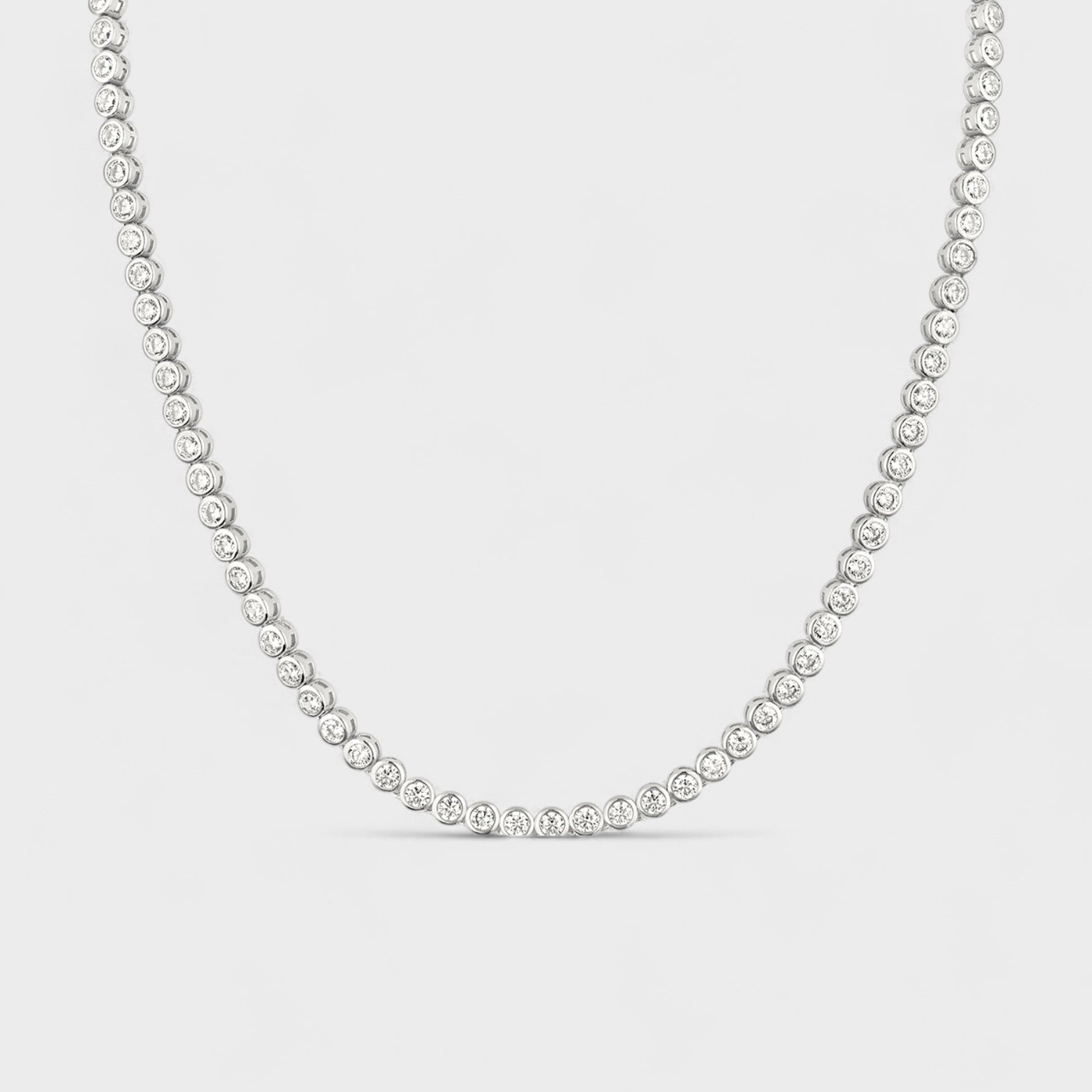CHOE sterling silver tennis necklace with cubic zirconia bezel setting - hero shot.