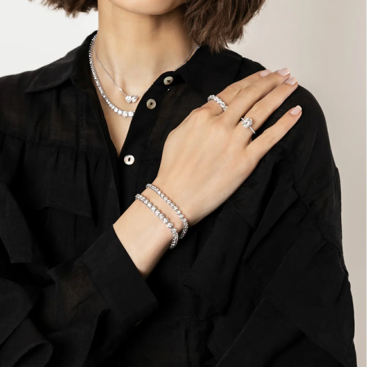 Person wearing CHOE tennis bracelets in silver - hero shot