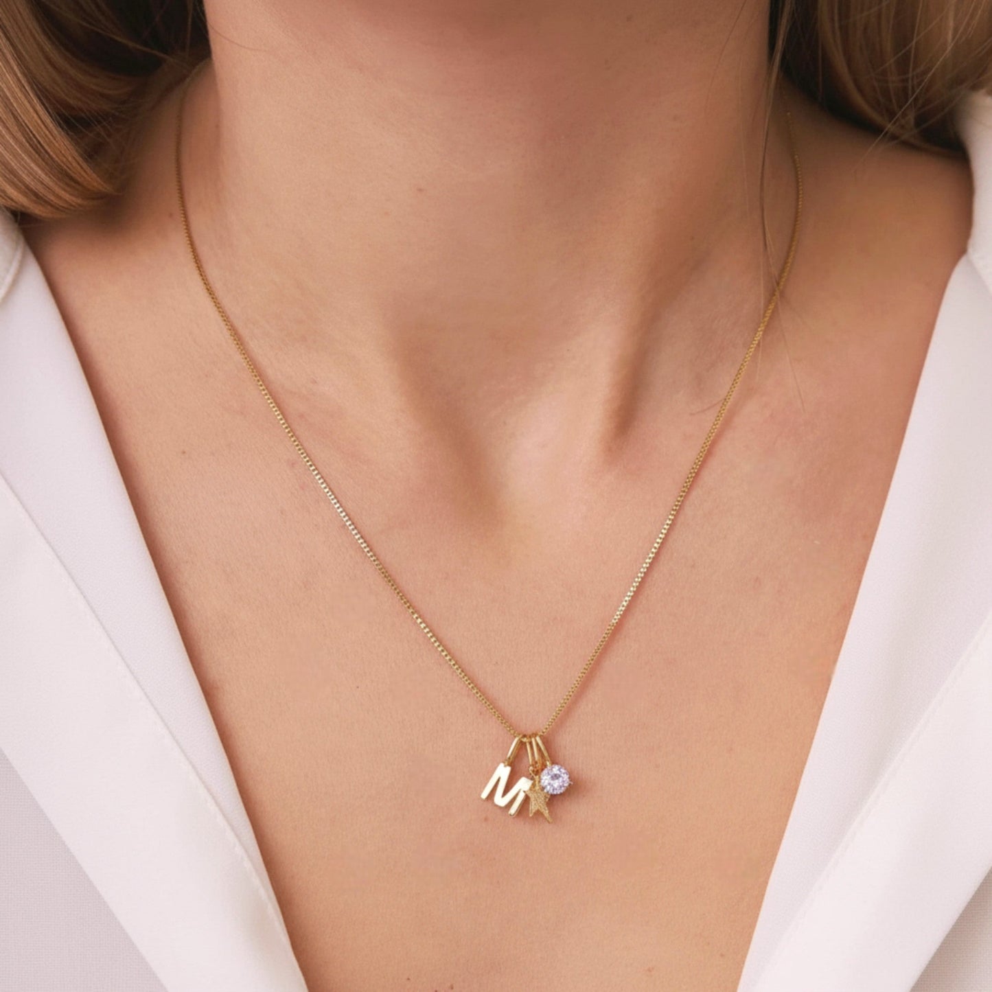  FYB personalized initial necklace in 18K gold plated sterling silver on a model's neck