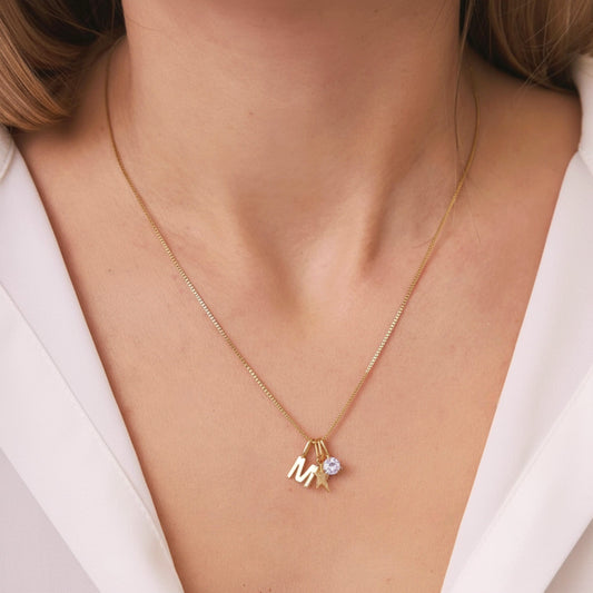  FYB personalized initial necklace in 18K gold plated sterling silver on a model's neck