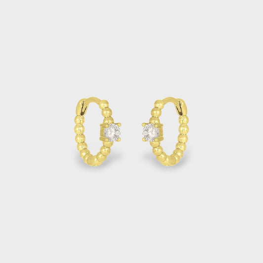 FYB Zia gold huggie earrings with single cubic zirconia stone