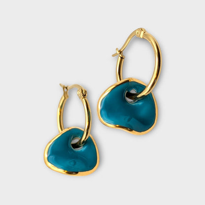 IRLÔH Maximilianas Ondulado Hoops: Gold plated stainless steel hoops with removable teal ceramic pendants. Hypoallergenic and tarnish resistant.