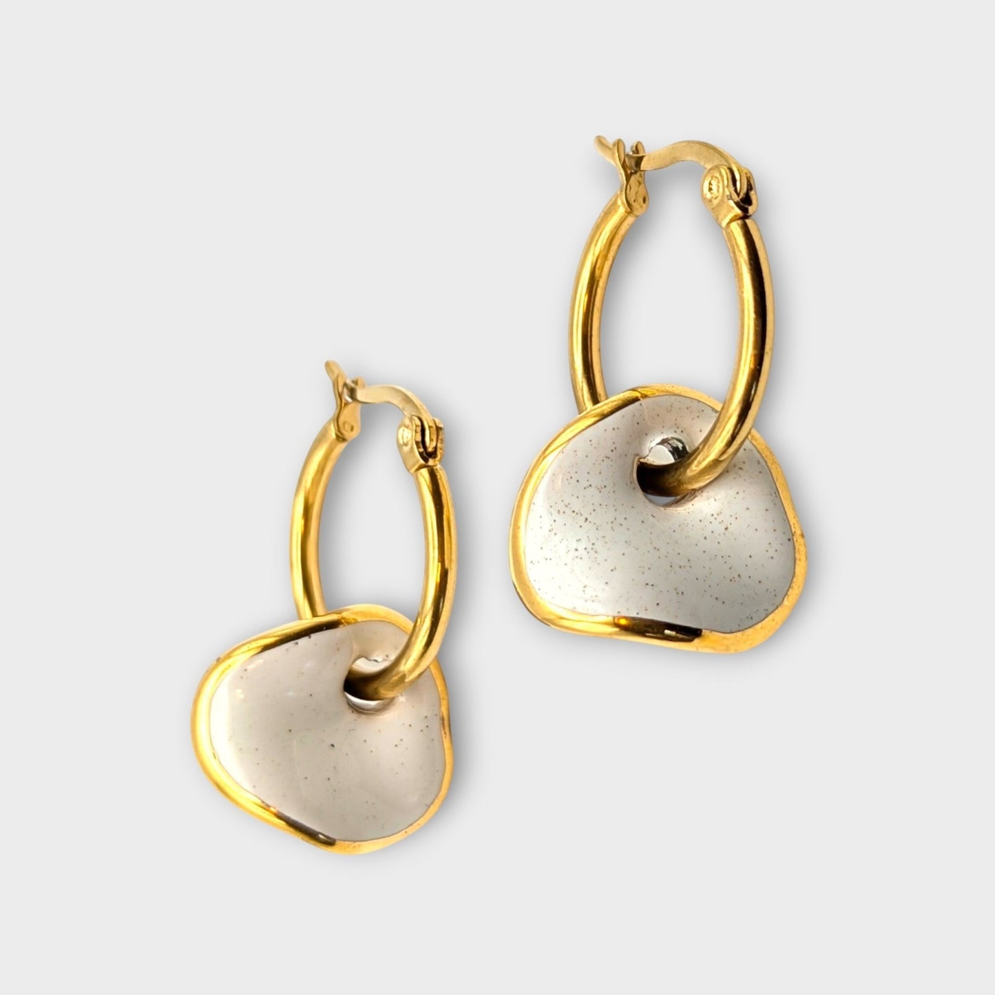 IRLÔH Maximilianas Ondulado Hoops: gold plated stainless steel hoops with removable speckled white ceramic pendants.