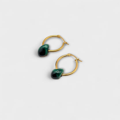 Maximilianas oval hoop earrings with green handcrafted ceramic bead - product shot from top angle