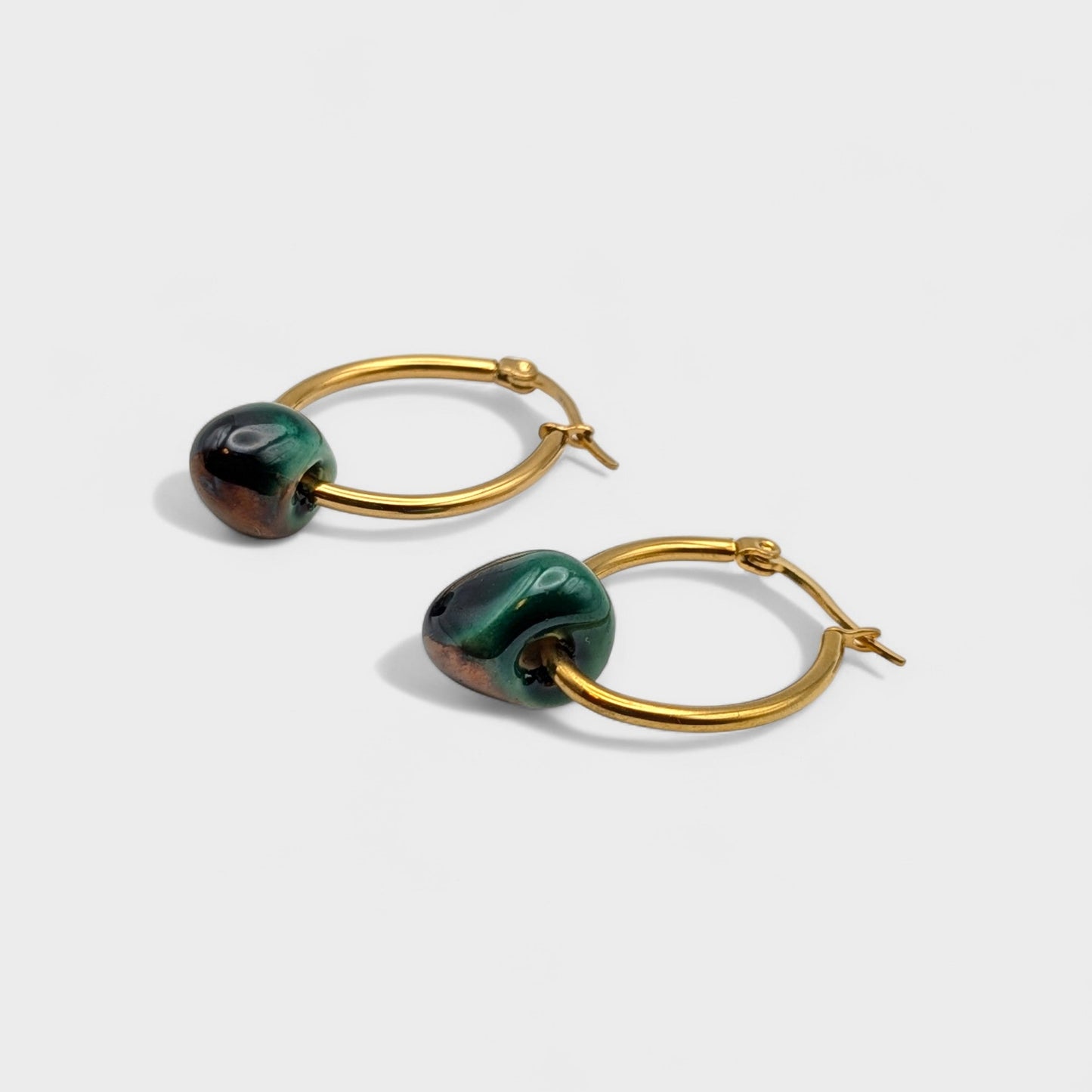 Maximilianas Petra oval hoop earrings with dark green and copper color ceramic bead