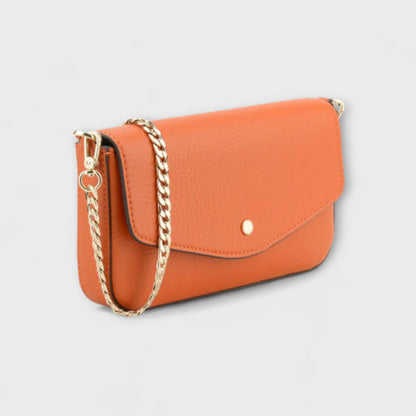 Pourchet Club orange with angled side front view showing gold chain on a light gray background.